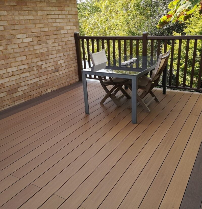 capped shiny composite decking layed in a garden