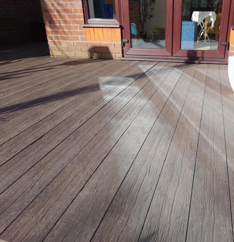 uncapped matte composite decking layed in a garden